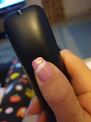 Pink Polygel and glitter on thumb nail